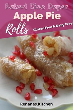 baked apple pie rolls on a white plate with pomegranates scattered around