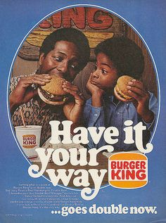 an advertisement for burger king with two children eating hamburgers and one is looking at the camera