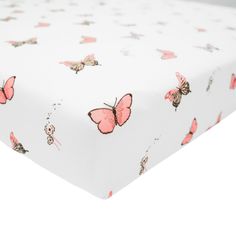 a white sheet with pink butterflies on it