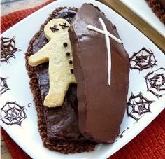 there is a chocolate cake decorated to look like a football player with a bone and cross on it