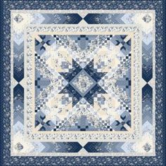 a blue and white quilt with an intricate design on the front, in shades of gray