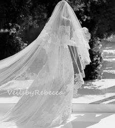 a woman in a wedding dress and veil