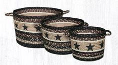 three black and white baskets with stars on the sides, one is brown and two are beige