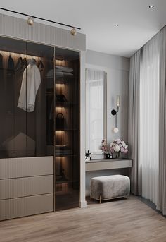 a walk in closet next to a dressing room with a bench and mirror on the wall