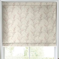 a window with a roman blind in front of it