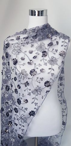 Silver / grey net shawl with silver floral pattern made with silver thread embroidery and sequins. Very elegant.  Gift it or keep it.  Size is approximate  Monitor colour is not accurate. Silver Shawl, Silver Scarf, Silver Embroidery, Wrap Gift, Bridal Wrap, Wedding Shawl, Gala Dinner, Net Fabric, Silver Sequin