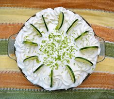 a pie with cucumbers on top is shown from above