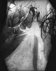 black and white photograph of a man on a skateboard going down a ramp with graffiti