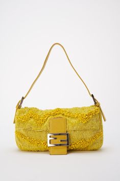 An incredibly rare bag! A Fendi 15th Anniversary Limited Edition Gialla Lemon Yellow Sparkly Iridescent Beaded baguette bag. Fendi recently re:launched this style and colour-way as they celebrated 25 years of the Baguette bag with 25 re-editions of the famous “under-the-arm” bag’s most iconic archived styles. This re:issue version retails for £4500, causing the original style to be in demand more than ever. This bag comes with the original dust bag, paper Fendi bag and a bag of spare beads for a Vintage Fendi Baguette, Designer Bags Louis Vuitton, Fendi Bag, Vintage Fendi, Burberry Sunglasses, 15th Anniversary, Fendi Baguette, Baguette Bag, Pretty Bags