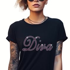 Elevate your style with our Rhinestone Diva T Shirt crafted from premium ringspun cotton for unmatched comfort and durability. Adorned with sparkling rhinestones, this T Shirt exudes wisdom and confidence. Embrace your inner strength while enjoying the softness and quality of our meticulously designed garment.  Size of Design  Width - 9.02 inches Height - 4.05 inches NOTE TO CUSTOMER'S *  All UK and International orders are dispatched tracked and signed. All T Shirts are made from 100% ring spun Graphic Tee With Rhinestones And Crew Neck, Rhinestone Cotton Crew Neck T-shirt, Cotton T-shirt With Rhinestones And Short Sleeves, Cotton T-shirt With Rhinestones Short Sleeve, Cotton Short Sleeve T-shirt With Rhinestones, Cotton Glitter Print T-shirt, Black Cotton T-shirt With Rhinestones, Rhinestone Graphic Tee, Tshirt Crafts