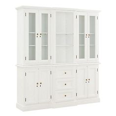 a white china cabinet with glass doors and drawers