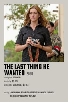 the last thing he wanted poster with woman in black shirt and red necklace holding camera