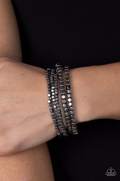 A dainty collection of glistening gunmetal cube beads are threaded along stretchy bands around the wrist, creating edgy layers.

 Sold as one set of four bracelets. Black Jelly Bracelets, Gunmetal Jewelry, Cube Beads, Toggle Bracelet, Black Bracelets, Paparazzi Accessories, Fashion 2024, Paparazzi Jewelry, Dream Jewelry