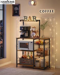 a small coffee bar with lights on the wall above it and an open microwave oven