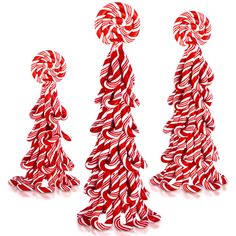 three red and white striped candy canes in the shape of trees on a white background