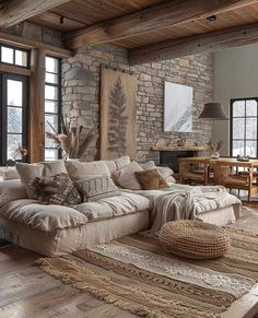 a living room filled with lots of furniture next to a brick wall and wooden floors