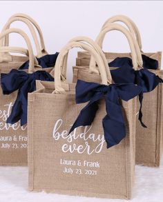 three burlap bags with blue ribbon tied around them and the words best day ever