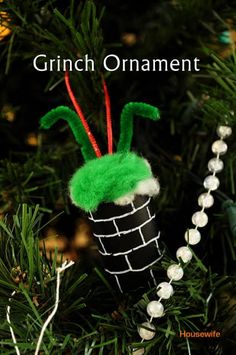 an ornament is hanging on a christmas tree with the words, grinch ornament