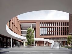 an open courtyard with stairs leading up to the building