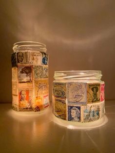 two jars with stamps on them sitting next to each other