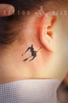 a person with a small tattoo on their ear