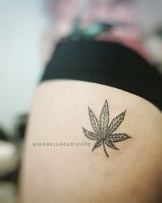 a woman's leg with a leaf tattoo on the side of her thigh that reads, disbebellacricaato