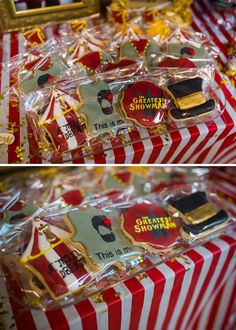 some cookies that are sitting on top of a red and white striped table cloths