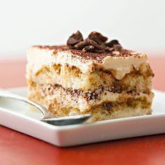 a piece of cake sitting on top of a white plate with a fork in it