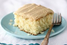 a piece of cake sitting on top of a blue plate next to a silver fork