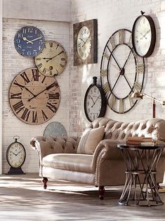 a living room filled with lots of clocks on the wall