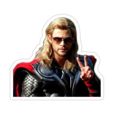 a man dressed as thor with sunglasses on giving the peace sign in front of him