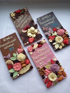 four chocolates decorated with flowers and hearts