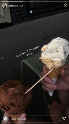 someone holding an ice cream cone with chocolate frosting on it, and another one has a stick sticking out of it