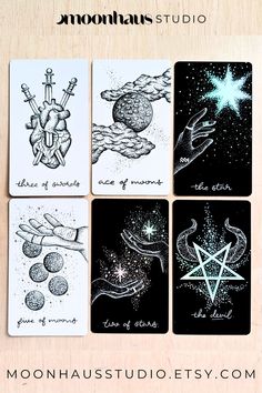 four cards with different designs on them and the words moondusts studio written in black ink