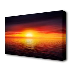 the sun is setting over the ocean on a cloudy day canvas wall art print by person