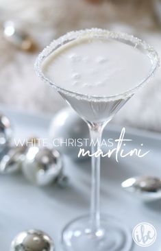 a white christmas martini is garnished with sugar