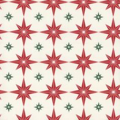 a red and green star pattern on white fabric