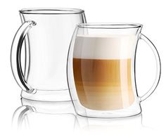 two glass mugs with liquid in them