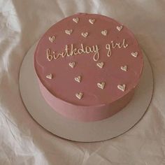 a pink birthday cake with hearts and the words'birthday girl'written on it