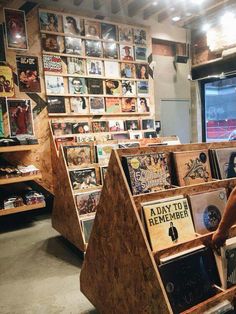 the man is standing in front of his record store