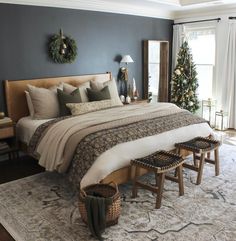 a bedroom decorated for christmas with blue walls