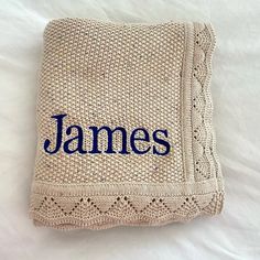 a knitted blanket with the name james on it