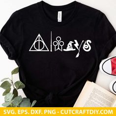 harry potter t - shirt with hogwarts symbols on it and some books next to it