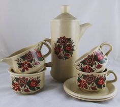 a tea set with matching saucers and cups