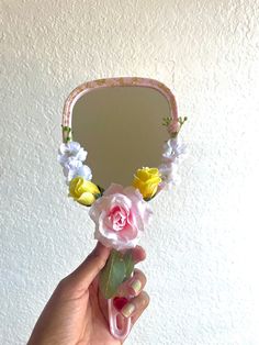 This pretty pink hand mirror would make a lovely addition to any vanity. This item is extremely fragile so please handle with care! This mirror is about 10 inches long. Looking for a one-of-a-kind friendship gift? Consider pairing this item with the 'Black Rose Hand Mirror' and qualify for free shipping! Feminine Mirror, Flower Knows Hand Mirror, Gold Hand Mirror, Vintage Mirrors Hand, Compact Mirror Rose, Vanity Makeup Table, Rose Mirror, Hand Mirrors, Room Vanity