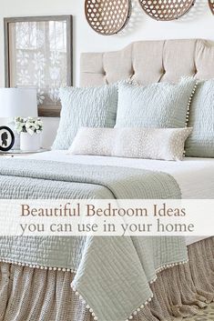 a cat sitting on top of a bed in a room with white walls and furniture