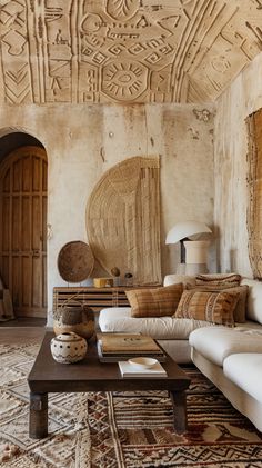 a living room filled with lots of furniture and decor on top of a wooden table