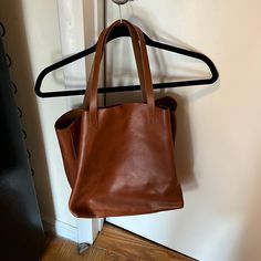 Never Used Madewell Leather Tote. Excellent Condition! Only Visible Mark From Storage. No Wear And Tear From Use. Style #53228 Madewell Tote Bag, Madewell Brown Leather Bag, Madewell Abroad Shoulder Bag, Madewell Black Tote, Madewell Transport Tote, Madewell Bags, Womens Tote Bags, Leather Tote, Madewell