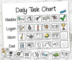 the daily task chart is displayed on a marble surface with clippings to describe it