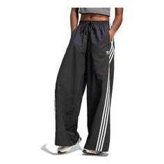 (WMNS) adidas originals Adilenium Oversized Track Pants 'Black' IV9318 Casual Adidas Bottoms, Relaxed Fit Three Stripes Sportswear Pants, Relaxed Fit Sportswear Pants With Three Stripes, Three Stripes Relaxed Fit Sportswear Pants, Relaxed Fit Sportswear Bottoms With Three Stripes, Adidas Sportswear Pants For Spring, Adidas Athleisure Pants With Logo, Adidas Relaxed Fit Sports Bottoms, Adidas Relaxed Fit Sport Bottoms